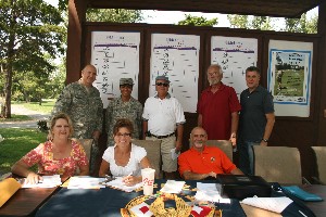 In August, the chapter sponsored its annual golf tournament and fundraiser. The event's planning committee, (front row, l-r) Becky Van Pool; Brenda Hill; Lou Bianco; (back row, l-r) Senior Master Sgt. Joseph O'Donnell, USAF; Col. Mary Gillam, USAF; Paul Pitcovich; Doug Hawkins; and Dale Myers, helps keep score.